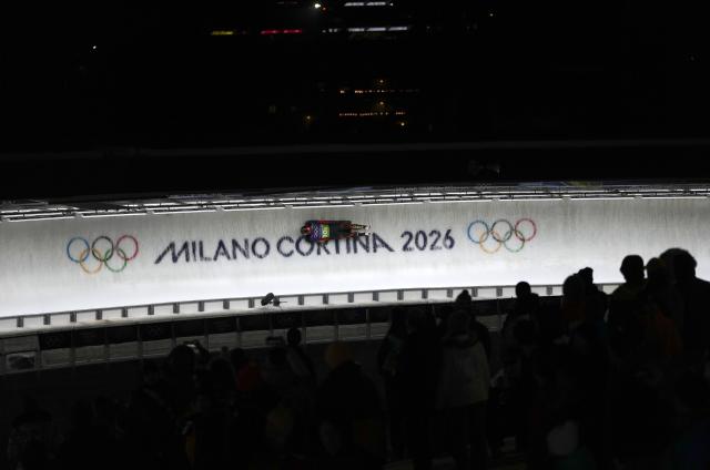 (260215) -- CORTINA D'AMPEZZO, Feb. 15, 2026 (Xinhua) -- Chen Wenhao of China competes during the skeleton mixed team event at the Milan-Cortina 2026 Olympic Winter Games in Cortina, Italy, Feb. 15, 2026. (Xinhua/Li Gang)