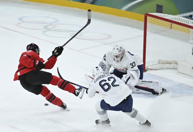 (260215) -- MILAN, Feb. 15, 2026 (Xinhua) -- Macklin Celebrini of Canada shoots during the ice hockey men's preliminary round group A match between Canada and France at the Milan-Cortina 2026 Olympic Winter Games in Milan, Italy, Feb. 15, 2026. (Xinhua/Zhang Haofu)