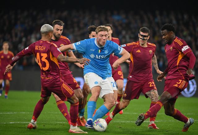 (260216) -- NAPLES, Feb. 16, 2026 (Xinhua) -- Napoli's Rasmus Hojlund (C) vies with Roma's Lima Wesley (L) , Bryan Cristante (2nd L), Gianluca Mancini (2nd R) and Evan Ndicka during a Serie A soccer match between Napoli and Roma in Naples, Italy, Feb. 15, 2026. (Photo by Alberto Lingria/Xinhua)
