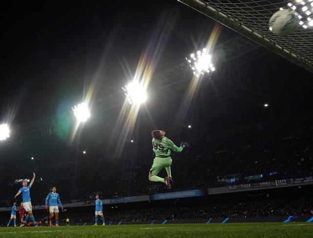 (260216) -- NAPLES, Feb. 16, 2026 (Xinhua) -- Roma's goalkeeper Mile Svilar fails to save the goal of Napoli's Leonardo Spinazzola during a Serie A soccer match between Napoli and Roma in Naples, Italy, Feb. 15, 2026. (Photo by Alberto Lingria/Xinhua)