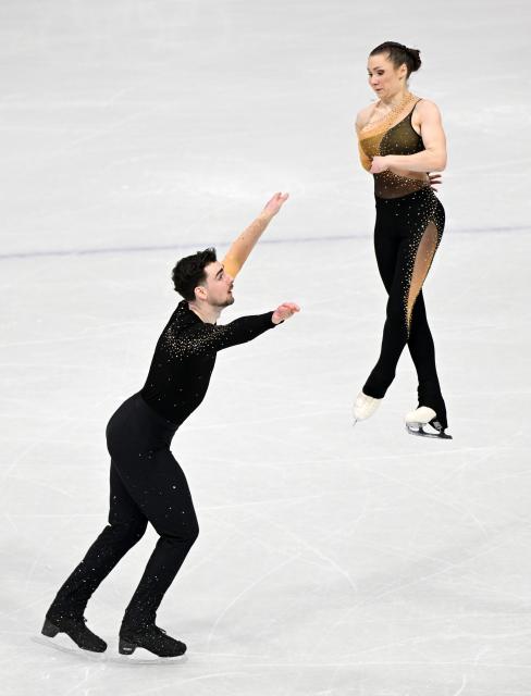 (260216) -- MILAN, Feb. 16, 2026 (Xinhua) -- Annika Hocke and Robert Kunkel of Germany perform during the figure skating pair skating short program match at the Milan-Cortina 2026 Olympic Winter Games in Milan, Italy, Feb. 15, 2026. (Xinhua/Cheng Min)
