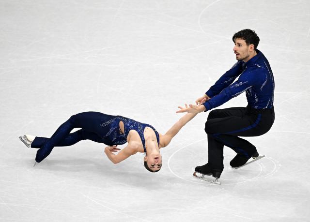 (260216) -- MILAN, Feb. 16, 2026 (Xinhua) -- Rebecca Ghilardi and Filippo Ambrosini of Italy perform during the figure skating pair skating short program match at the Milan-Cortina 2026 Olympic Winter Games in Milan, Italy, Feb. 15, 2026. (Xinhua/Cheng Min)