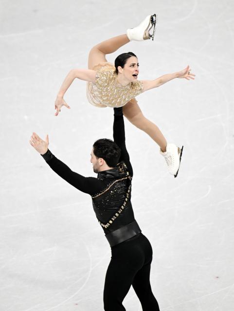 (260216) -- MILAN, Feb. 16, 2026 (Xinhua) -- Deanna Stellato-Dudek and Maxime Deschamps of Canada perform during the figure skating pair skating short program match at the Milan-Cortina 2026 Olympic Winter Games in Milan, Italy, Feb. 15, 2026. (Xinhua/Cheng Min)