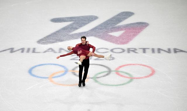 (260216) -- MILAN, Feb. 16, 2026 (Xinhua) -- Maria Pavlova and Alexei Sviatchenko of Hungary perform during the figure skating pair skating short program match at the Milan-Cortina 2026 Olympic Winter Games in Milan, Italy, Feb. 15, 2026. (Xinhua/Cheng Min)