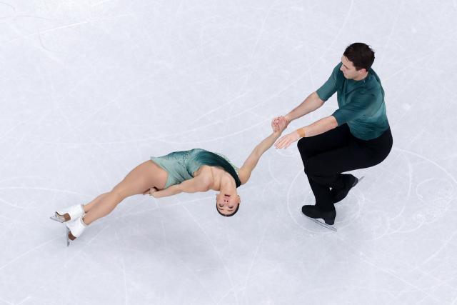 (260216) -- MILAN, Feb. 16, 2026 (Xinhua) -- Anastasia Vaipan-Law/Luke Digby of the Britain perform during the figure skating pair skating short program match at the Milan-Cortina 2026 Olympic Winter Games in Milan, Italy, Feb. 15, 2026. (Xinhua/Chen Yichen)