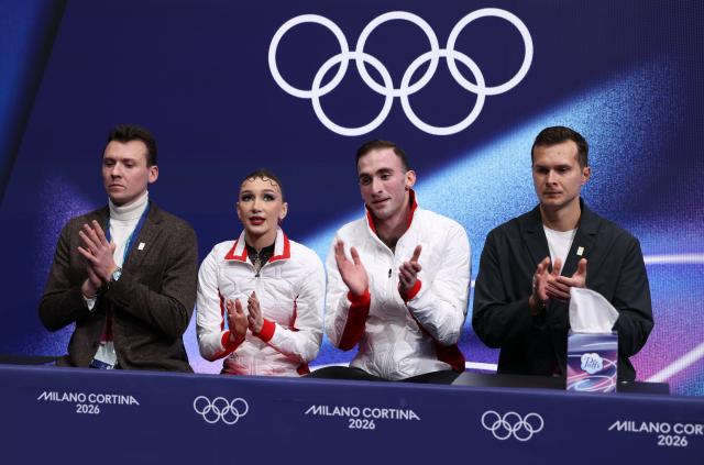 (260216) -- MILAN, Feb. 16, 2026 (Xinhua) -- Anastasiia Metelkina and Luka Berulava of Georgia react after their performance during the figure skating pair skating short program match at the Milan-Cortina 2026 Olympic Winter Games in Milan, Italy, Feb. 15, 2026. (Xinhua/Chen Yichen)