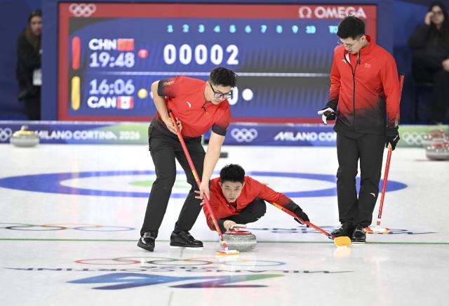 (260216) -- CORTINA D'AMPEZZO, Feb. 16, 2026 (Xinhua) -- Fei Xueqing (C), Li Zhichao (L) and Xu Jingtao of China compete during the curling men round robin session 7 match between China and Canada at the 2026 Milan-Cortina Winter Olympics in Cortina, Italy, Feb. 15, 2026. (Xinhua/Lian Yi)