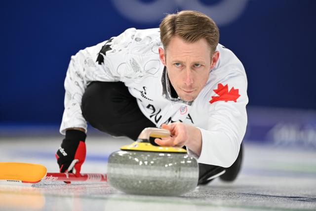 (260216) -- CORTINA D'AMPEZZO, Feb. 16, 2026 (Xinhua) -- Marc Kennedy of Canada competes during the curling men round robin session 7 match between China and Canada at the 2026 Milan-Cortina Winter Olympics in Cortina, Italy, Feb. 15, 2026. (Xinhua/Lian Yi)