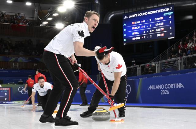(260216) -- CORTINA D'AMPEZZO, Feb. 16, 2026 (Xinhua) -- Marc Kennedy of Canada competes during the curling men round robin session 7 match between China and Canada at the 2026 Milan-Cortina Winter Olympics in Cortina, Italy, Feb. 15, 2026. (Xinhua/Lian Yi)
