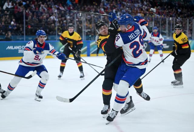 (260216) -- MILAN, Feb. 16, 2026 (Xinhua) -- Moritz Seider (L, front) of Germany vies with Brock Nelson (R, front) of the United States during the ice hockey men's preliminary round group C match between the United States and Germany at the Milan-Cortina 2026 Olympic Winter Games in Milan, Italy, Feb. 15, 2026. (Xinhua/Zhang Haofu)