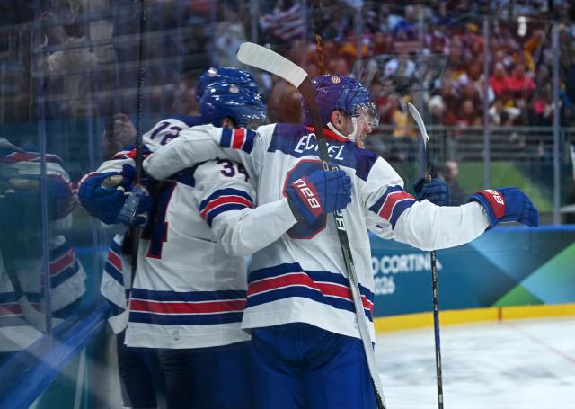 (260216) -- MILAN, Feb. 16, 2026 (Xinhua) -- Players of the United States celebrate during the ice hockey men's preliminary round group C match between the United States and Germany at the Milan-Cortina 2026 Olympic Winter Games in Milan, Italy, Feb. 15, 2026. (Xinhua/Zhang Haofu)