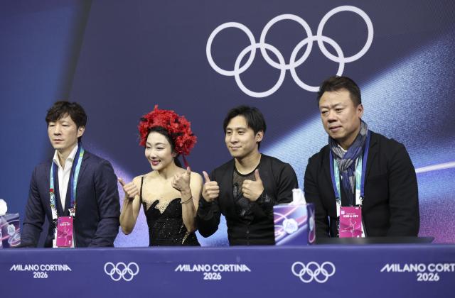 (260216) -- MILAN, Feb. 16, 2026 (Xinhua) -- Sui Wenjing and Han Cong of China react after their performance during the figure skating pair skating short program match at the Milan-Cortina 2026 Olympic Winter Games in Milan, Italy, Feb. 15, 2026. (Xinhua/Li Ming)