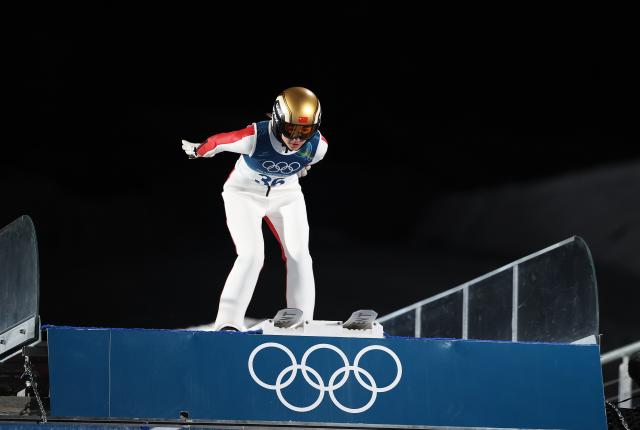 (260216) -- PREDAZZO, Feb. 16, 2026 (Xinhua) -- Zeng Ping of China competes during the first round of ski jumping women's large hill individual event at the Milan-Cortina 2026 Olympic Winter Games in Predazzo, Italy, Feb. 15, 2026. (Xinhua/Huang Wei)