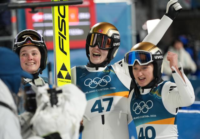 (260216) -- PREDAZZO, Feb. 16, 2026 (Xinhua) -- Norway's Anna Odine Stroem (C) celebrates after ski jumping women's large hill individual event at the Milan-Cortina 2026 Olympic Winter Games in Predazzo, Italy, Feb. 15, 2026. (Xinhua/Meng Yongmin)
