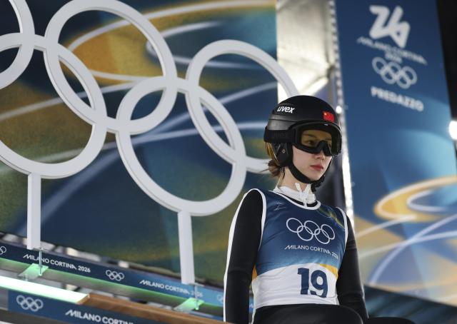 (260216) -- PREDAZZO, Feb. 16, 2026 (Xinhua) -- Dong Bing of China competes during the trial round of ski jumping women's large hill individual event at the Milan-Cortina 2026 Olympic Winter Games in Predazzo, Italy, Feb. 15, 2026. (Xinhua/Huang Wei)