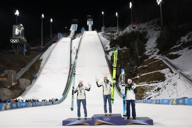 (260216) -- PREDAZZO, Feb. 16, 2026 (Xinhua) -- Silver medallist Norway's Eirin Maria Kvandal, gold medallist Norway's Anna Odine Stroem and bronze medallist Slovenia's Nika Prevc (L to R) celebrate on the podium for of ski jumping women's large hill individual event at the Milan-Cortina 2026 Olympic Winter Games in Predazzo, Italy, Feb. 15, 2026. (Xinhua/Huang Wei)