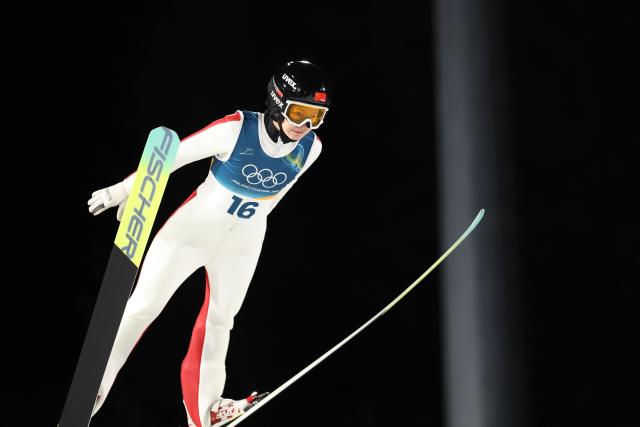(260216) -- PREDAZZO, Feb. 16, 2026 (Xinhua) -- Liu Qi of China competes during the first round of ski jumping women's large hill individual event at the Milan-Cortina 2026 Olympic Winter Games in Predazzo, Italy, Feb. 15, 2026. (Xinhua/Huang Wei)