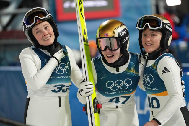 (260216) -- PREDAZZO, Feb. 16, 2026 (Xinhua) -- Norway's Anna Odine Stroem (C) reacts after ski jumping women's large hill individual event at the Milan-Cortina 2026 Olympic Winter Games in Predazzo, Italy, Feb. 15, 2026. (Xinhua/Meng Yongmin)