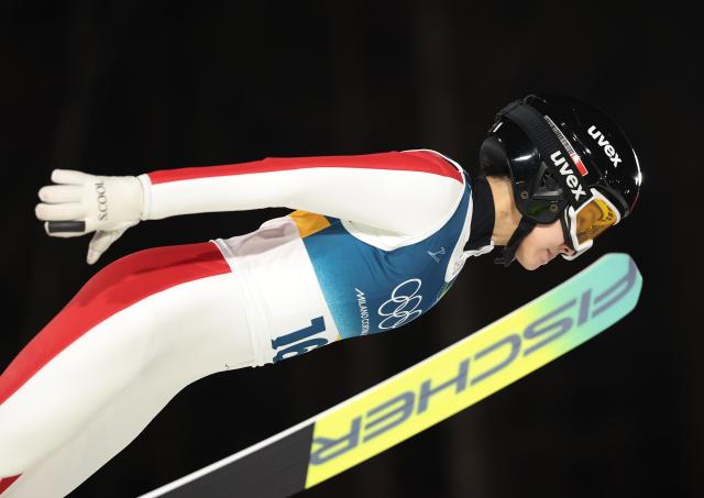 (260216) -- PREDAZZO, Feb. 16, 2026 (Xinhua) -- Liu Qi of China competes during the first round of ski jumping women's large hill individual event at the Milan-Cortina 2026 Olympic Winter Games in Predazzo, Italy, Feb. 15, 2026. (Xinhua/Huang Wei)