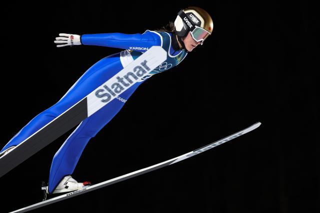 (260216) -- PREDAZZO, Feb. 16, 2026 (Xinhua) -- Abigail Strate of Canada competes during the first round of ski jumping women's large hill individual event at the Milan-Cortina 2026 Olympic Winter Games in Predazzo, Italy, Feb. 15, 2026. (Xinhua/Huang Wei)