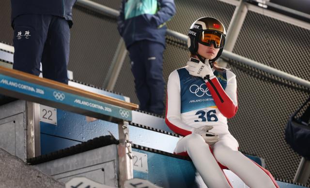 (260216) -- PREDAZZO, Feb. 16, 2026 (Xinhua) -- Zeng Ping of China competes during the trial round of ski jumping women's large hill individual event at the Milan-Cortina 2026 Olympic Winter Games in Predazzo, Italy, Feb. 15, 2026. (Xinhua/Huang Wei)
