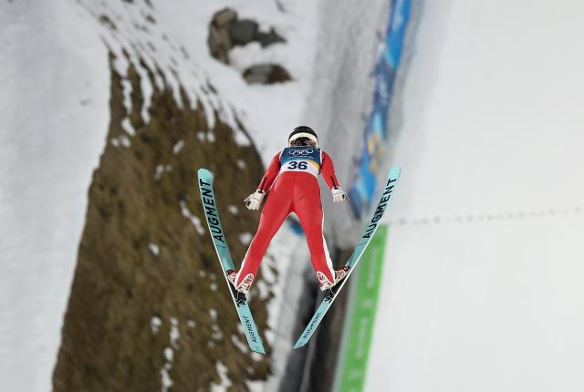 (260216) -- PREDAZZO, Feb. 16, 2026 (Xinhua) -- Zeng Ping of China competes during the first round of ski jumping women's large hill individual event at the Milan-Cortina 2026 Olympic Winter Games in Predazzo, Italy, Feb. 15, 2026. (Xinhua/Huang Wei)