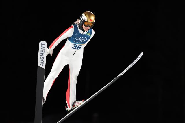 (260216) -- PREDAZZO, Feb. 16, 2026 (Xinhua) -- Zeng Ping of China competes during the first round of ski jumping women's large hill individual event at the Milan-Cortina 2026 Olympic Winter Games in Predazzo, Italy, Feb. 15, 2026. (Xinhua/Huang Wei)