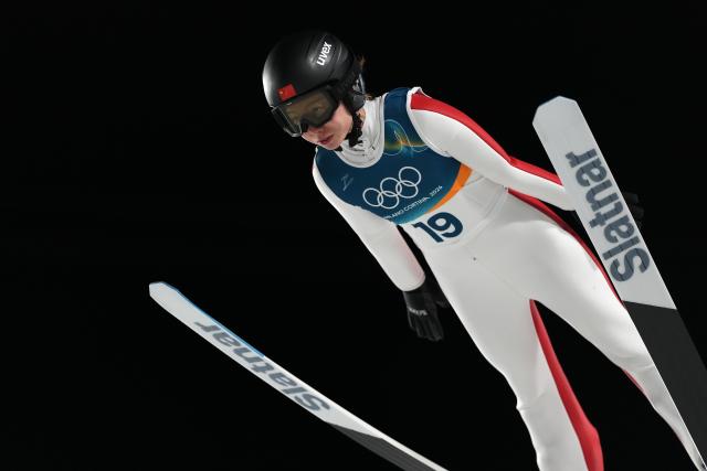 (260216) -- PREDAZZO, Feb. 16, 2026 (Xinhua) -- Dong Bing of China competes during the first round of ski jumping women's large hill individual event at the Milan-Cortina 2026 Olympic Winter Games in Predazzo, Italy, Feb. 15, 2026. (Xinhua/Meng Yongmin)