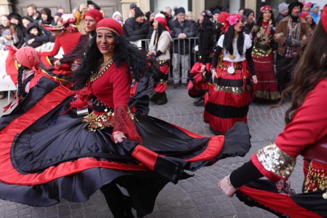 (260216) -- PTUJ, Feb. 16, 2026 (Xinhua) -- Women dressed as gipsies present themselves at a masquerade parade during the international carnival festival in Ptuj, Slovenia, Feb. 15, 2026. (Photo by Zeljko Stevanic/Xinhua)