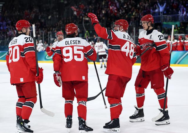 (260216) -- MILAN, Feb. 16, 2026 (Xinhua) -- Players of Denmrak celebrate after the ice hockey men's preliminary round group C match between Denmark and Latvia at the Milan-Cortina 2026 Olympic Winter Games in Milan, Italy, Feb. 15, 2026. (Xinhua/Wang Kaiyan)