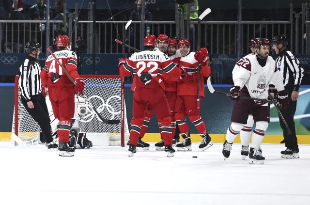 (260216) -- MILAN, Feb. 16, 2026 (Xinhua) -- Players of Denmark celebrate during the ice hockey men's preliminary round group C match between Denmark and Latvia at the Milan-Cortina 2026 Olympic Winter Games in Milan, Italy, Feb. 15, 2026. (Xinhua/Wang Kaiyan)