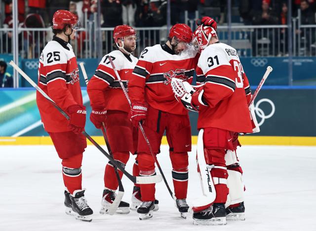 (260216) -- MILAN, Feb. 16, 2026 (Xinhua) -- Players of Denmrak celebrate after the ice hockey men's preliminary round group C match between Denmark and Latvia at the Milan-Cortina 2026 Olympic Winter Games in Milan, Italy, Feb. 15, 2026. (Xinhua/Wang Kaiyan)