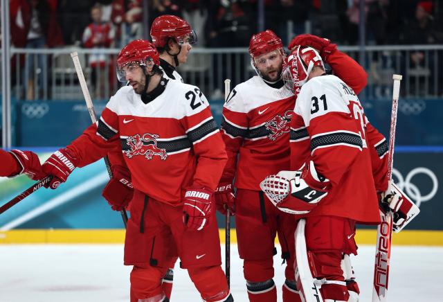 (260216) -- MILAN, Feb. 16, 2026 (Xinhua) -- Players of Denmrak celebrate after the ice hockey men's preliminary round group C match between Denmark and Latvia at the Milan-Cortina 2026 Olympic Winter Games in Milan, Italy, Feb. 15, 2026. (Xinhua/Wang Kaiyan)