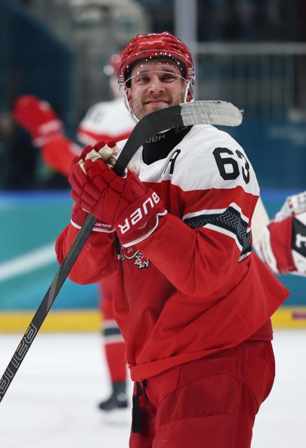 (260216) -- MILAN, Feb. 16, 2026 (Xinhua) -- Patrick Russell of Denmark reacts after the ice hockey men's preliminary round group C match between Denmark and Latvia at the Milan-Cortina 2026 Olympic Winter Games in Milan, Italy, Feb. 15, 2026. (Xinhua/Wang Kaiyan)