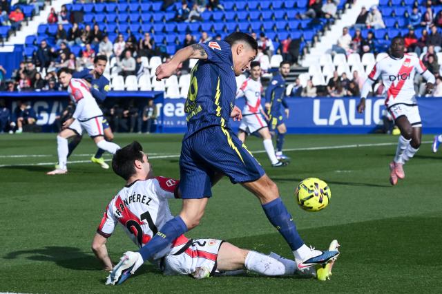 (260216) -- MADRID, Feb. 16, 2026 (Xinhua) -- Fran Perez (bottom) of Vallecano vies with Nahuel Molina of Atletico de Madrid during the La Liga football match between Rayo Vallecano and Atletico de Madrid in Madrid, Spain, Feb. 15, 2026. (Photo by Gustavo Valiente/Xinhua)