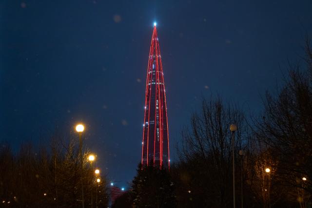 (260216) -- ST. PETERSBURG, Feb. 16, 2026 (Xinhua) -- This photo taken on Feb. 15, 2026 shows Lakhta Center, the tallest building in Russia, illuminated in "China red" to celebrate the Chinese New Year in St. Petersburg, Russia. (Photo by Guo Feizhou/Xinhua)