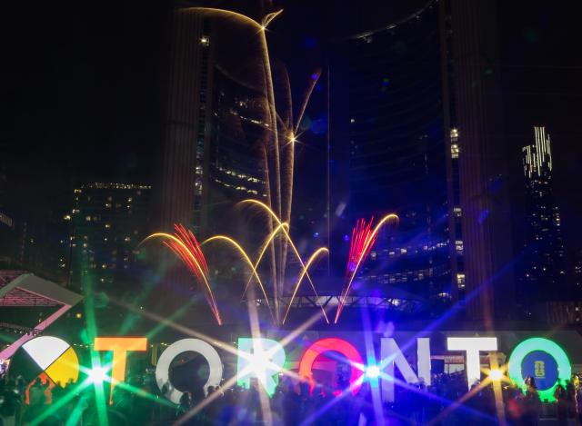 (260216) -- TORONTO, Feb. 16, 2026 (Xinhua) -- A fireworks show is staged around the Toronto City Hall in celebration of the upcoming Chinese New Year in Toronto, Canada, on Feb. 15, 2026. (Photo by Zou Zheng/Xinhua)