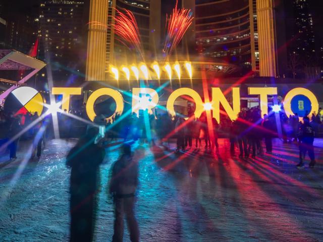 (260216) -- TORONTO, Feb. 16, 2026 (Xinhua) -- A fireworks show is staged around the Toronto City Hall in celebration of the upcoming Chinese New Year in Toronto, Canada, on Feb. 15, 2026. (Photo by Zou Zheng/Xinhua)