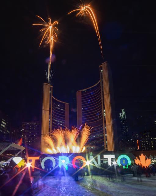 (260216) -- TORONTO, Feb. 16, 2026 (Xinhua) -- A fireworks show is staged around the Toronto City Hall in celebration of the upcoming Chinese New Year in Toronto, Canada, on Feb. 15, 2026. (Photo by Zou Zheng/Xinhua)