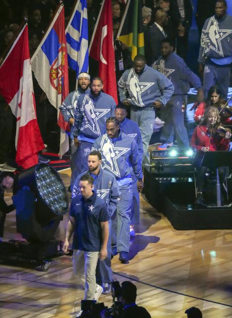 (260216) -- LOS ANGELES, Feb. 16, 2026 (Xinhua) -- Players of Team USA Stripes enter the court before the NBA All Star Game between Team USA Stripes and Team USA Stars in Los Angeles, the United States, Feb. 15, 2026. (Photo by Sun Yuxuan/Xinhua)