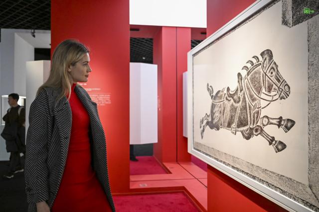 (260216) -- SHANGHAI, Feb. 16, 2026 (Xinhua) -- Aleksandra Antonenko visits an exhibition at Shanghai Museum in Shanghai, east China, Feb. 6, 2026.
  Aleksandra Antonenko moved from Russia to pursue her doctorate at Shanghai Jiao Tong University in 2022. She also began to show the charm of everyday life in China to the world with short video clips. 
  In the same year, she met Zhao Yiwei, now her husband, at a coffee shop. Zhao always encourages and supports her diligence, be it in academic pursue or in vlog production.
  With the Spring Festival around the corner, Aleksandra loves wandering through streets and picking out New Year goods. Back to her home, she adds her own tradition to the celebration by cooking Russian dishes for the holiday, turning the table into a blend of two cultures. 
  "The Spring Festival has deep cultural roots," Aleksandra said. "It's a time to bring family together and feel closer."
  Looking ahead, she plans to keep working toward her doctoral degree while continuing to document her life in China through videos. "Every day here brings something new," she said. "I'm excited to share real stories about China with the world."
  From a newbie international student to a Chinese daughter-in-law and a builder of cultural connections, Aleksandra's story reflects a simple belief: love knows no borders. (Xinhua/Chen Haoming)