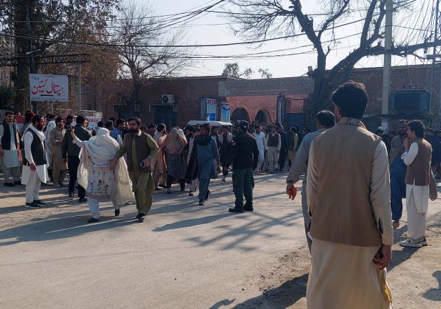 (260216) -- BANNU, Feb. 16, 2026 (Xinhua) -- People gather outside a hospital in Bannu district of Khyber Pakhtunkhwa province, Pakistan, Feb. 16, 2026.
  At least two people, including a child, were killed and several others injured in a blast in Pakistan's northwest Khyber Pakhtunkhwa province on Monday, police said. (Str/Xinhua)