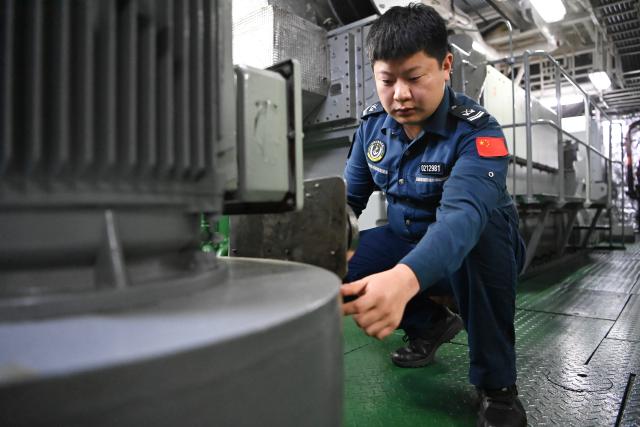 (260216) -- SOUTH CHINA SEA, Feb. 16, 2026 (Xinhua) -- Law enforcer Liu Chunyu checks a fresh water pump aboard the China Coast Guard (CCG) vessel Wanshan in the territorial waters of China's Huangyan Dao on Feb. 12, 2026.
  Law enforcers aboard the China Coast Guard (CCG) vessel Wanshan remain on duty during this year's Spring Festival, a most cherished moment for family reunions in China. (Photo by Zhai Yifan/Xinhua)
