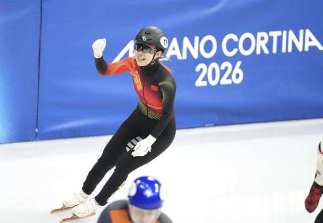 (260216) -- MILAN, Feb. 16, 2026 (Xinhua) -- Gong Li of China reacts after the short track speed skating women's 1000m semifinal at the Milan-Cortina 2026 Olympic Winter Games in Milan, Italy, Feb. 16, 2026. (Xinhua/Xue Yuge)