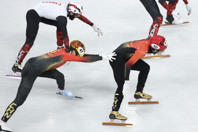(260216) -- MILAN, Feb. 16, 2026 (Xinhua) -- Zhang Bohao (L, front) and Lin Xiaojun (R) of China compete during the short track speed skating men's 5000m relay semifinal at the Milan-Cortina 2026 Olympic Winter Games in Milan, Italy, Feb. 16, 2026. (Xinhua/Li Ming)