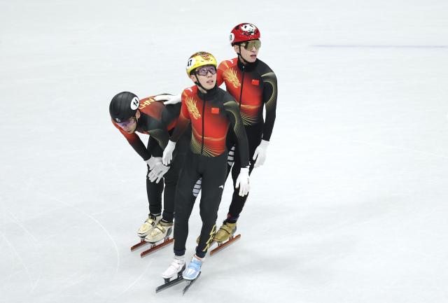 (260216) -- MILAN, Feb. 16, 2026 (Xinhua) -- Liu Shaoang (L), Zhang Bohao (C) and Lin Xiaojun of China react after the short track speed skating men's 5000m relay semifinal at the Milan-Cortina 2026 Olympic Winter Games in Milan, Italy, Feb. 16, 2026. (Xinhua/Li Ming)