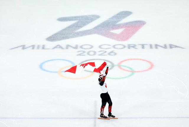 (260216) -- MILAN, Feb. 16, 2026 (Xinhua) -- Courtney Sarault of Canada celebrates after the short track speed skating women's 1000m final A at the Milan-Cortina 2026 Olympic Winter Games in Milan, Italy, Feb. 16, 2026. (Xinhua/Li Ming)