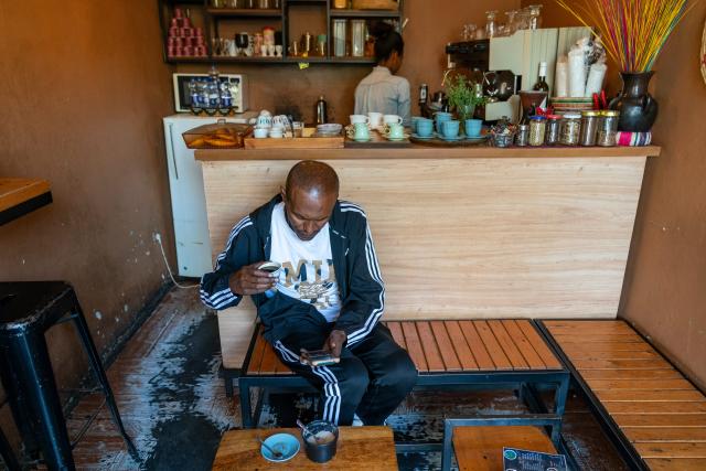 (260216) -- ADDIS ABABA, Feb. 16, 2026 (Xinhua) -- A customer enjoys coffee at a cafe in Addis Ababa, Ethiopia, Feb. 15, 2026.
  Regarded as the origin of Arabica coffee, Ethiopia is one of Africa's largest producers and exporters of the commodity. Coffee production is seen as the backbone of the country's agriculture-led economy.
  Widely recognized for its quality and rich flavors, ranging from winy to fruity and chocolatey, the country's coffee has been in great demand across the globe. (Xinhua/Xie Jianfei)