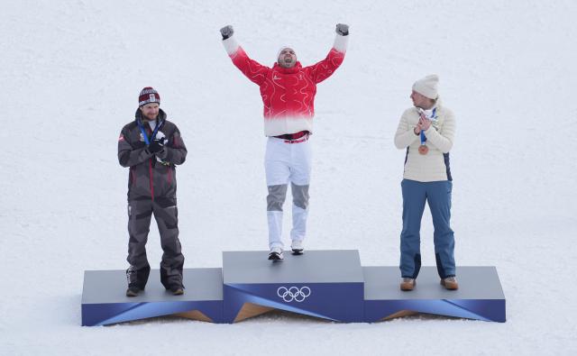 (260216) -- BORMIO, Feb. 16, 2026 (Xinhua) -- Gold medalist Loic Meillard (C) of Switzerland, silver medalist Fabio Gstrein (L) of Austria, and bronze medalist Henrik Kristoffersen of Norway attend the awarding ceremony of the alpine skiing men's slalom event at the Milan-Cortina 2026 Olympic Winter Games in Bormio, Italy, Feb. 16, 2026. (Xinhua/Hu Huhu)