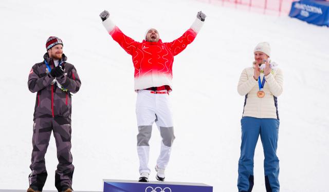 (260216) -- BORMIO, Feb. 16, 2026 (Xinhua) -- Gold medalist Loic Meillard (C) of Switzerland, silver medalist Fabio Gstrein (L) of Austria and bronze medalist Henrik Kristoffersen of Norway celebrate during the awarding ceremony of the alpine skiing men's slalom event at the Milan-Cortina 2026 Olympic Winter Games in Bormio, Italy, Feb. 16, 2026. (Xinhua/Yan Linyun)